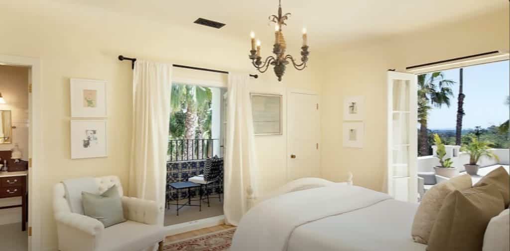 The bedroom with a bathroom and two different balconies